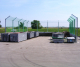 Stationary reinforced catch fence system with cantilever for garbage handling point, recycling center